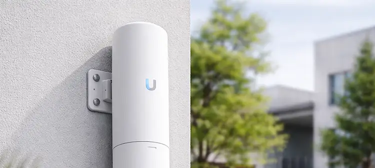 UniFi outdoor access point installed on an exterior wall using PoE power