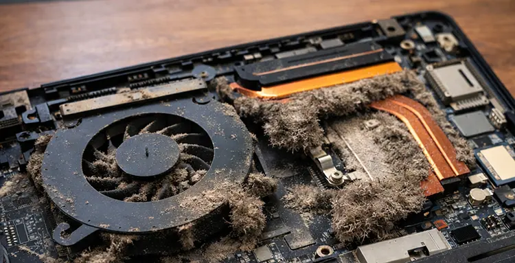 Dust buildup inside the cooling system of laptop